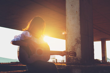 Candid silhouette woman chill play acoustic guitar musician .Artists female sad mood activity music
