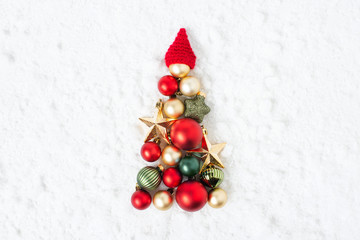 Fototapeta na wymiar Christmas tree of various festive balls and stars