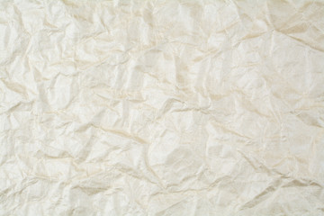 Obraz premium The light wrinkled paper structure.