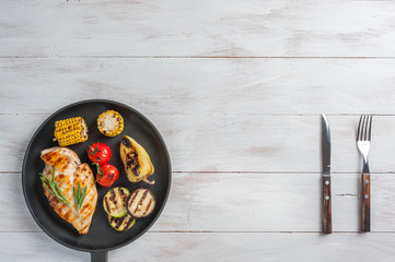 Chicken fried fillet and grilled vegetables
