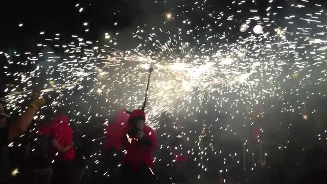 Barcelona, Spain - July 15 2019 : Fire Demons in the street for the fire run, correfoc during la street festival. 		