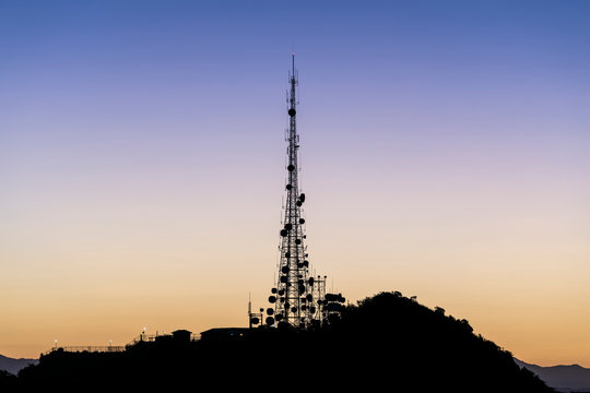 Dawn view of Griffith Park communication tower on Mt Lee above Hollywood in Los Angeles, California.  