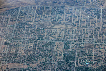 Aerial city view with houses and buildings in Egypt. Flying above country