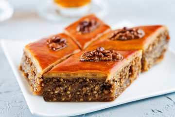 walnut baklava with glasses of tea