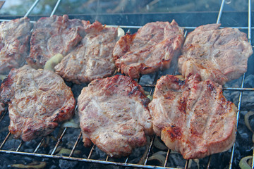 Process of cooking meat. Steak on barbecue. Preparation appetizing pork outside