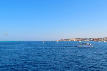 View of coast of Hurghada and ship in sea. Panorama of Red sea near Hurghada