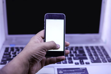 online shopping concept: close-up of hands using touch screen smartphone and holding