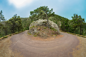 One of the tight turns of a narrow rural road in the mountains of Parque Natural Majona. View of the north-eastern part of La Gomera island. Canary Islands, Spain