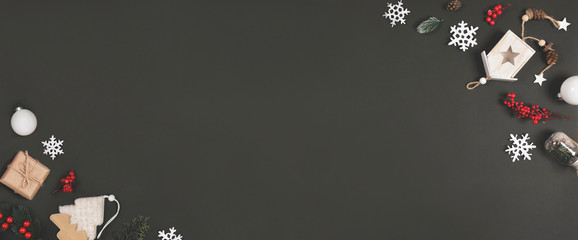Christmas decoration on a black background with space for text. Top view. Flat lay