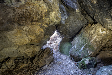 Naklejka na ściany i meble A small cave in gypsum rock