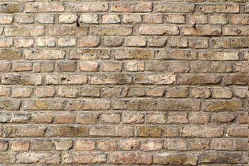 texture of an old light brick stone wall, background