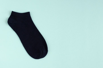 Kids socks composition on blue background. Flat lay.