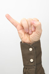 Male hand with fingers raised up little finger against white background