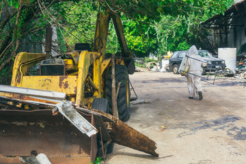 beekeeper walking with tools on construction site