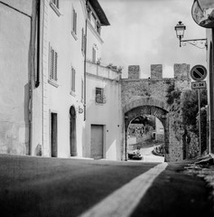 The old narrow streets in the medieval town of Massa Marittima in Tuscany shot with analogue film technique - 1