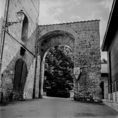 The old narrow streets in the medieval town of Massa Marittima in Tuscany shot with analogue film technique - 4