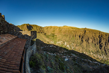 Parking at the observation point overlooking the gorge Valle gran Rey - Grate King Valley. Viewpoint and restaurant constructed by canarian architect Cesar Manrique. La Gomera, Canaryislands, Spain