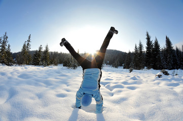 Carefree and happy female in the snowy nature