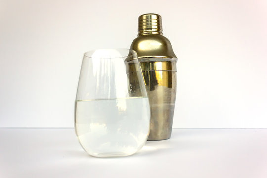 cocktail shaker and a glass alcohol on a white background vodka tequiladistilled beverage