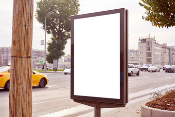 Empty billboard, advertising city format in Moscow on the street, view on traffic, mockup of a blank white poster.
