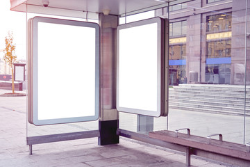 Two empty city format billboards, advertising in Moscow public space on bus stop, mockup of a blank white poster.