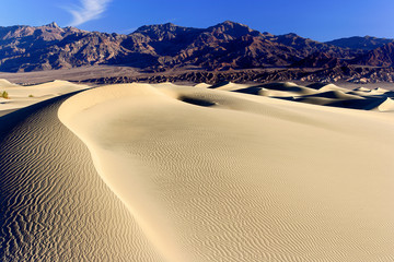 Fototapeta na wymiar Sand dunes and mountains