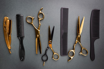 Various hair dresser and cut tools on black background with copy space