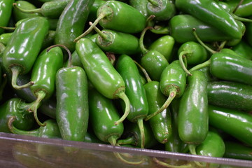 green jalapeno peppers at the market