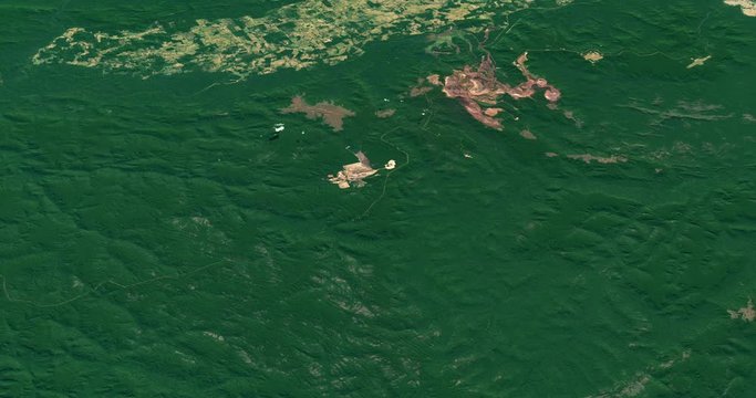 Very high-altitude circular tracking shot of mines and encroaching deforestation, Brazil's Carajas Mountains. Reversible, seamless loop. Elements of this image furnished by NASA