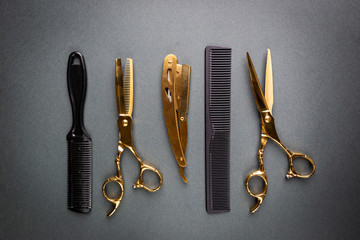 Various hair dresser and cut tools on black background with copy space