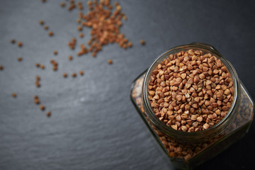 buckwheat in a jar close-up on a dark background