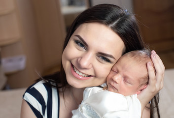 Young mother with a baby boy