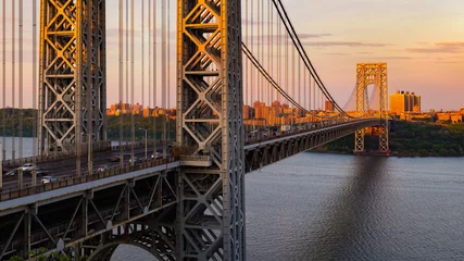 Fotobehang The George Washington Bridge (long-span suspension bridge) across the Hudson River at sunset. Uptown and Fort Washington Park, New York City, USA © Francois Roux