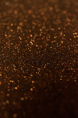 Abstract glitter shining lights background. De-focused lights