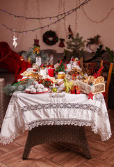 Celebration Christmas Eve. Traditional Christmas sweets cookies biscuits pastry dessert for family. Christmas New Year ornament decorations. Christmas Eve table