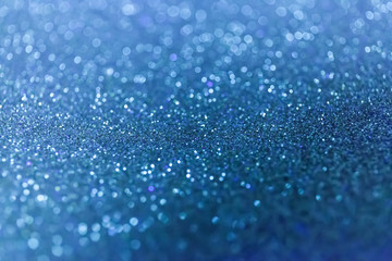 Abstract glitter shining lights background. De-focused lights