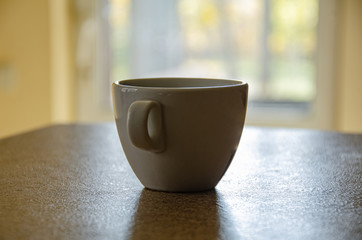 Morning cup of coffee on a window background. Favorite cup of coffee.
