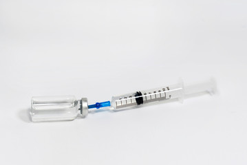 Medical syringe with  liquid on white background