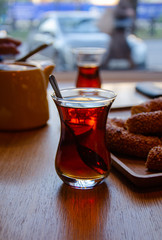 A glass of Turkish tea in a cozy city cafe