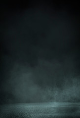 Empty background scene. Dark street reflection on the wet pavement. Rays neon light in the dark, neon figures, smoke. Night view of the street, the city. Abstract dark background. Abstract spotlight.