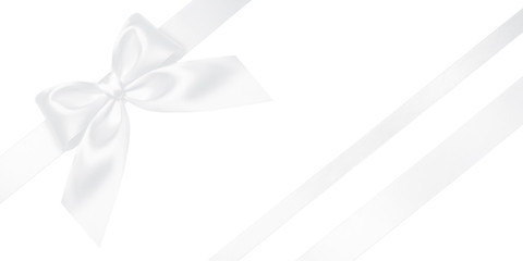 White ribbon with gift bow isolated on white. Christmas festive bow of white shiny satin ribbon and...