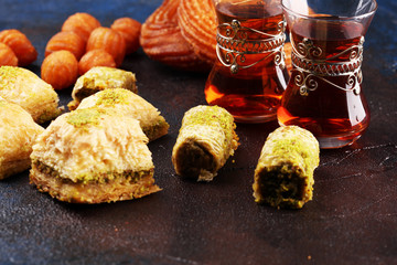 Baklava on table. Middle eastern or arabic dishes. Turkish Dessert Baklava with pistachio on rustic...