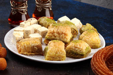 Baklava on table. Middle eastern or arabic dishes. Turkish Dessert Baklava with pistachio on rustic table