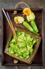 Zucchini ribbon salad with parsley, dill and garlic in marinade