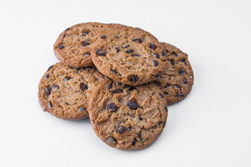 Homemade cookies with dark chocolate chips on white background