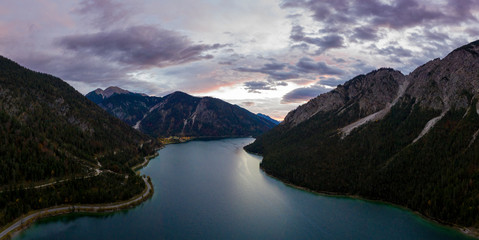 dusk sunrise aerial view to lake plansee at reutte breitenwang