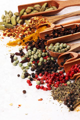 Spices with pepper on table. Food and cuisine ingredients for cooking on rustic background