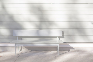 bench against white wall