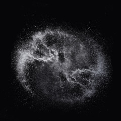 Solt powder explosion, flying pepper on black background, Freeze motion photo