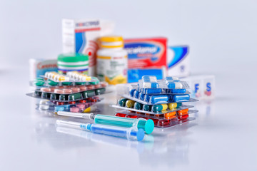 Drug prescription for treatment medication. Pharmaceutical medicament, cure in container for health. Pharmacy theme, capsule pills with medicine antibiotic in packages.